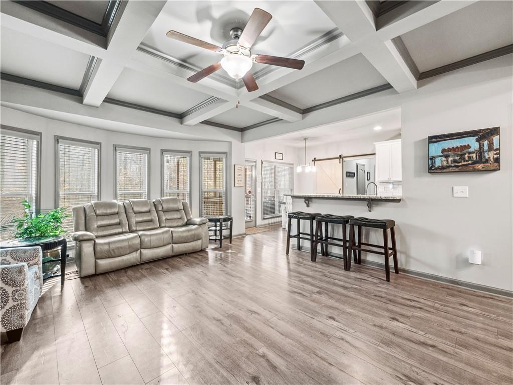 816 Mimosa Way Jefferson, GA 30549 - Photo 11 of 43 a living room with furniture and wooden floor