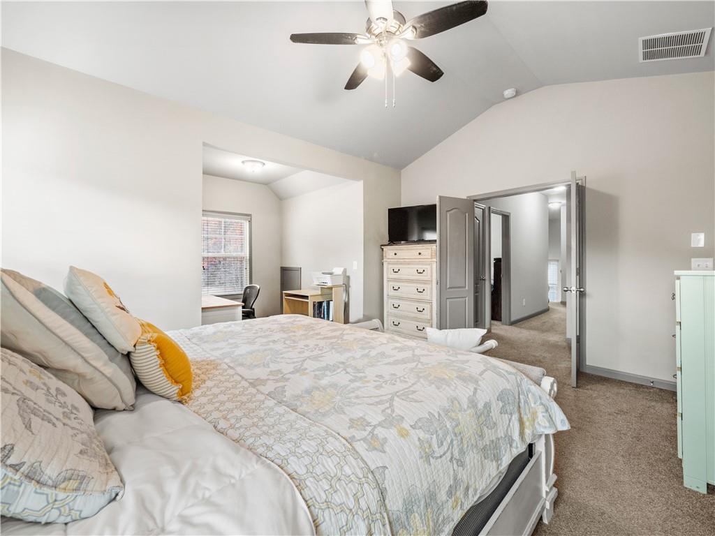 816 Mimosa Way Jefferson, GA 30549 - Photo 23 of 43 a spacious bedroom with a bed and a large mirror