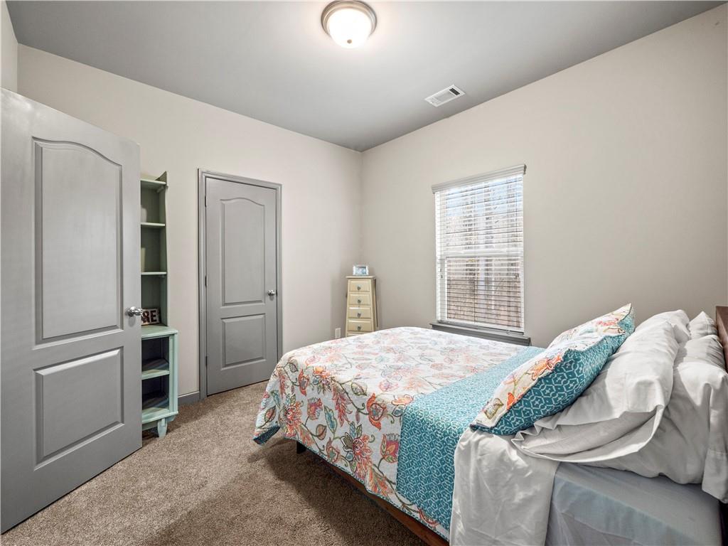 816 Mimosa Way Jefferson, GA 30549 - Photo 30 of 43 a bedroom with a bed and a window