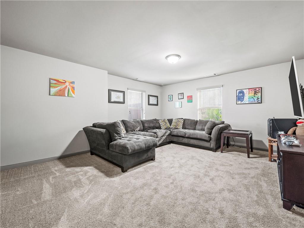 816 Mimosa Way Jefferson, GA 30549 - Photo 33 of 43 a living room with furniture and a couch