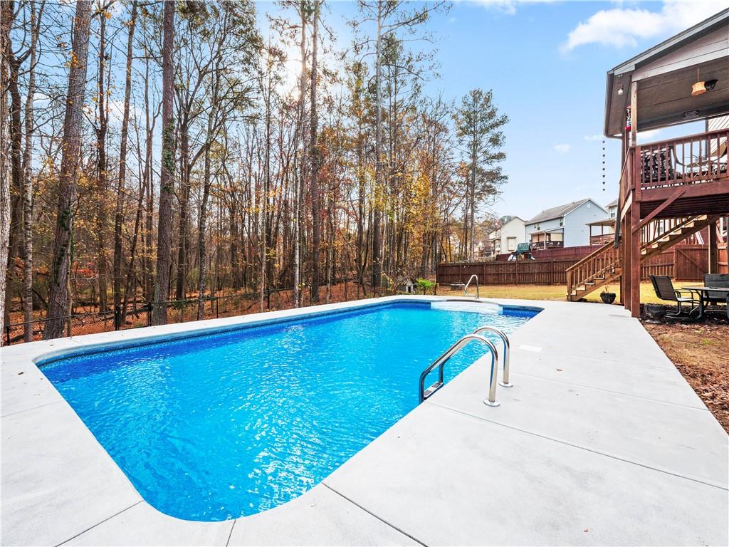 816 Mimosa Way Jefferson, GA 30549 - Photo 41 of 43 a view of swimming pool with outdoor seating and plants