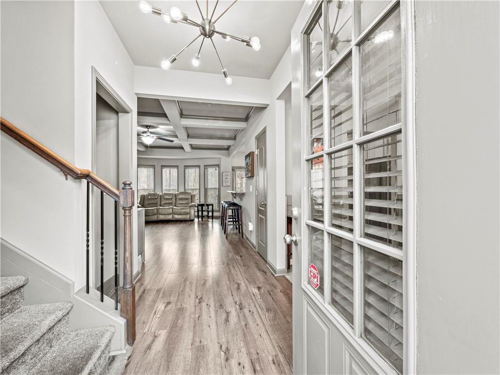 816 Mimosa Way Jefferson, GA 30549 - Photo 6 of 43 a view of a hallway with wooden floor and staircase