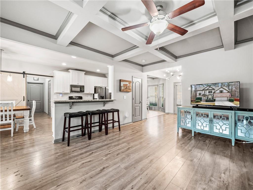 816 Mimosa Way Jefferson, GA 30549 - Photo 10 of 43 a view of a room with furniture and wooden floor