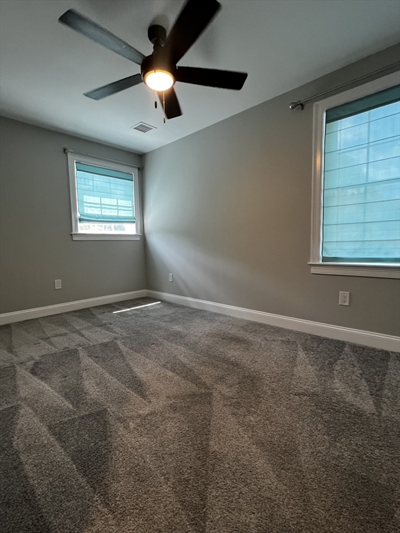 181 Christina Street, Unit 1 Newton, MA 02461 - Photo 11 of 24 a view of an empty room with a window