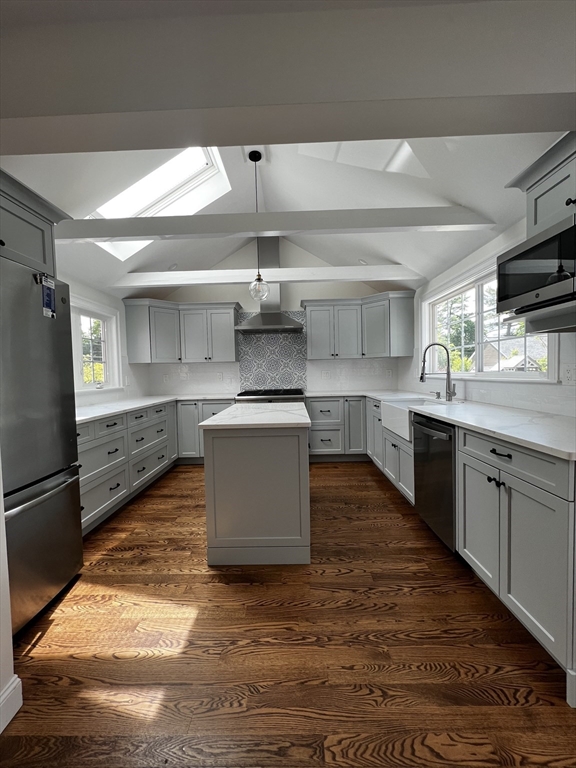 181 Christina Street, Unit 1 Newton, MA 02461 - Photo 2 of 24 a kitchen with kitchen island granite countertop a sink cabinets and stainless steel appliances