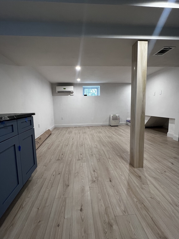 181 Christina Street, Unit 1 Newton, MA 02461 - Photo 21 of 24 a view of empty room with wooden floor
