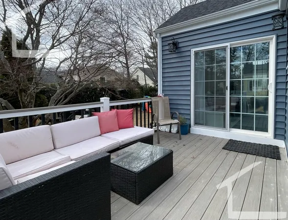 a outdoor space with patio the couches and a dining table with large window