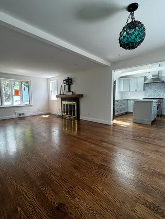 a view of kitchen and dining room with wooden floor