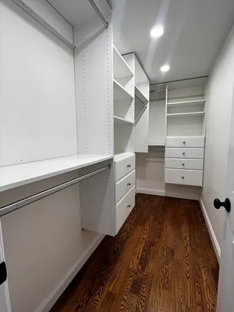 a view of an empty walk in closet
