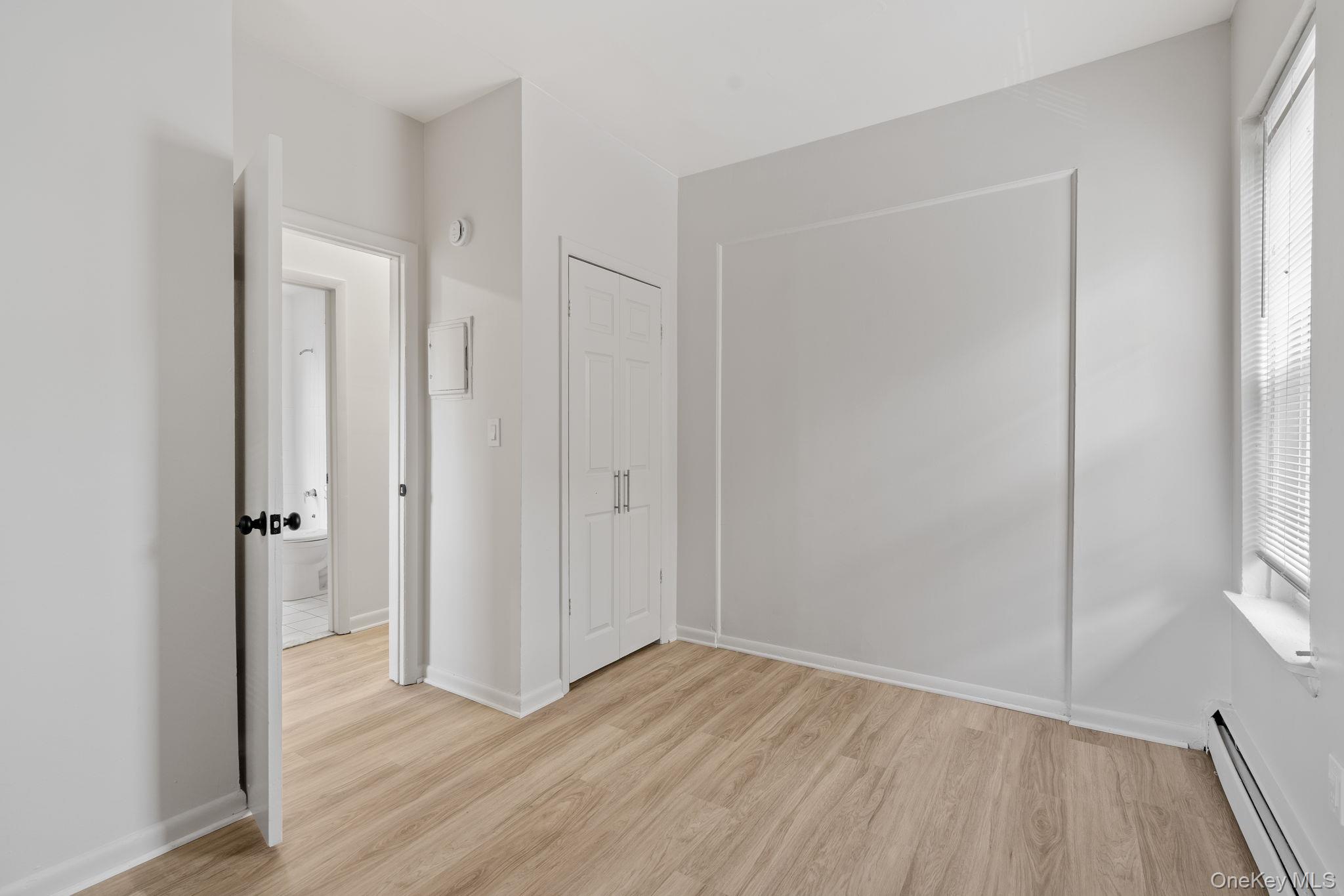 32 North Bridge Street Poughkeepsie, NY 12601 - Photo 9 of 19 a view of an empty room with wooden floor and a window