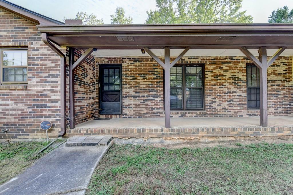 5680 Abbotts Bridge Road Johns Creek, GA 30097 - Photo 31 of 63 a front view of a house with garden