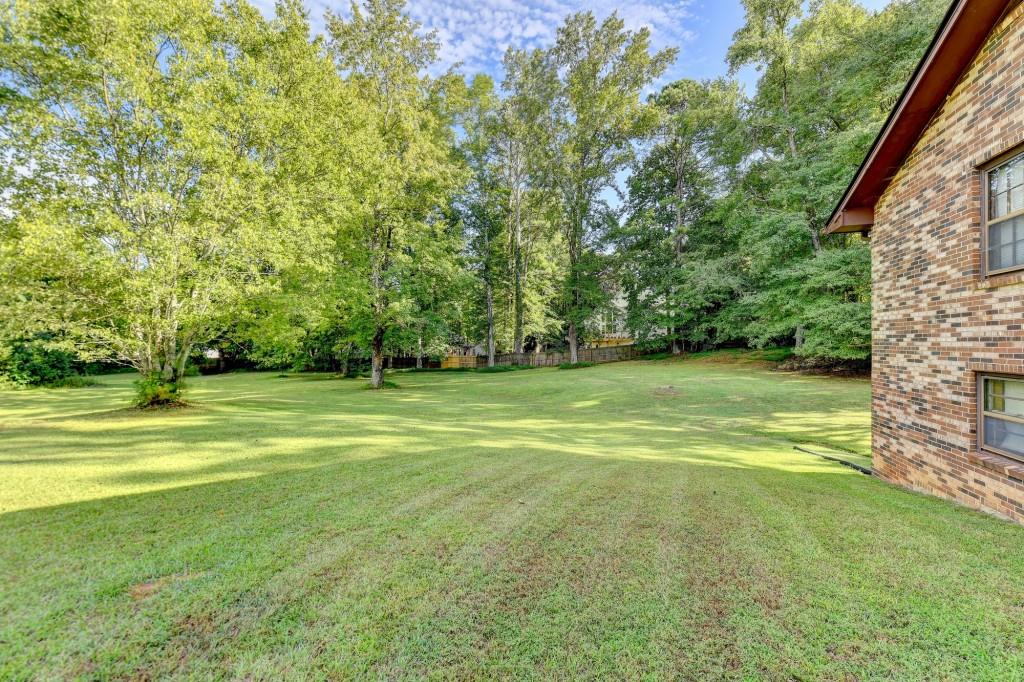 5680 Abbotts Bridge Road Johns Creek, GA 30097 - Photo 34 of 63 a view of a yard with a trees