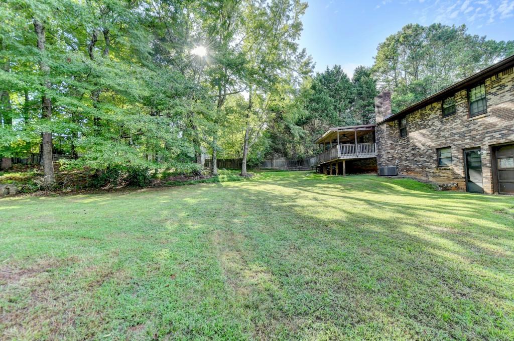 5680 Abbotts Bridge Road Johns Creek, GA 30097 - Photo 36 of 63 a view of a house with a yard