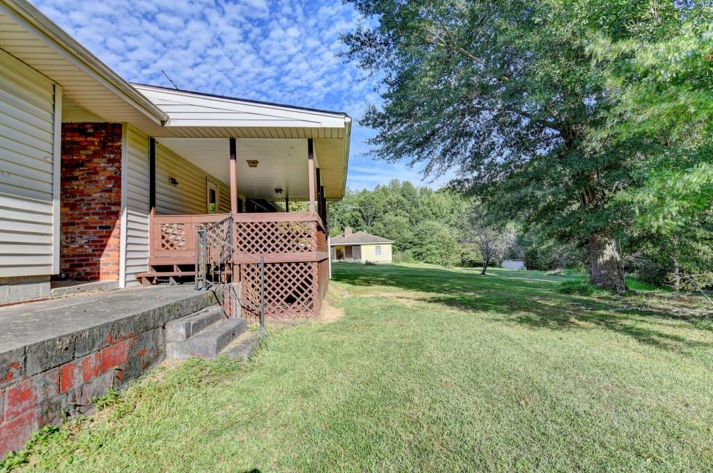 5680 Abbotts Bridge Road Johns Creek, GA 30097 - Photo 41 of 63 a front view of a house with garden