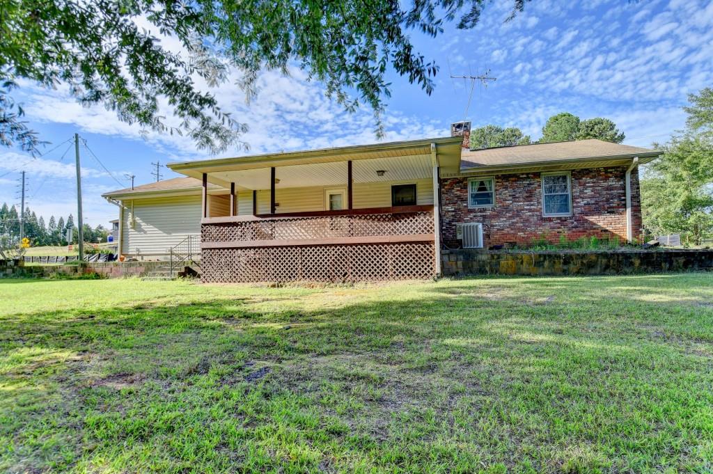 5680 Abbotts Bridge Road Johns Creek, GA 30097 - Photo 43 of 63 a view of a house with a yard balcony