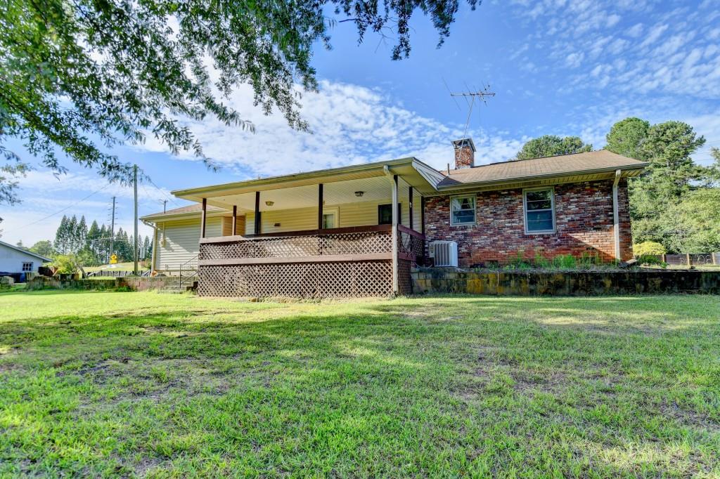 5680 Abbotts Bridge Road Johns Creek, GA 30097 - Photo 44 of 63 a view of a house with a yard