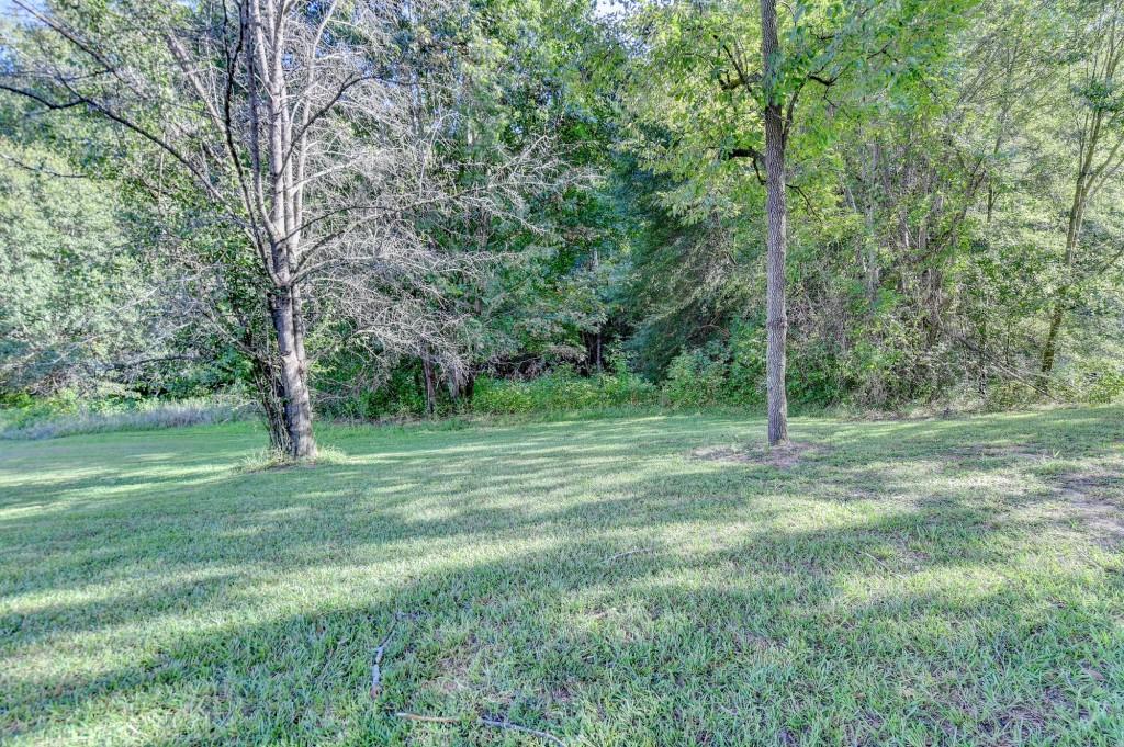 5680 Abbotts Bridge Road Johns Creek, GA 30097 - Photo 45 of 63 a view of outdoor space with trees all around