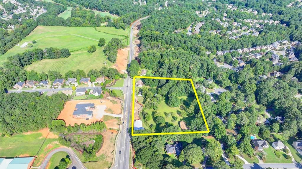 5680 Abbotts Bridge Road Johns Creek, GA 30097 - Photo 49 of 63 an aerial view of residential houses with outdoor space and street view