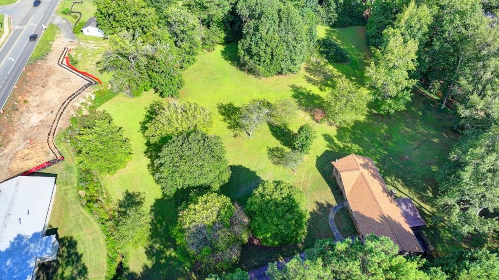 5680 Abbotts Bridge Road Johns Creek, GA 30097 - Photo 63 of 63 an aerial view of residential house with swimming pool and green space