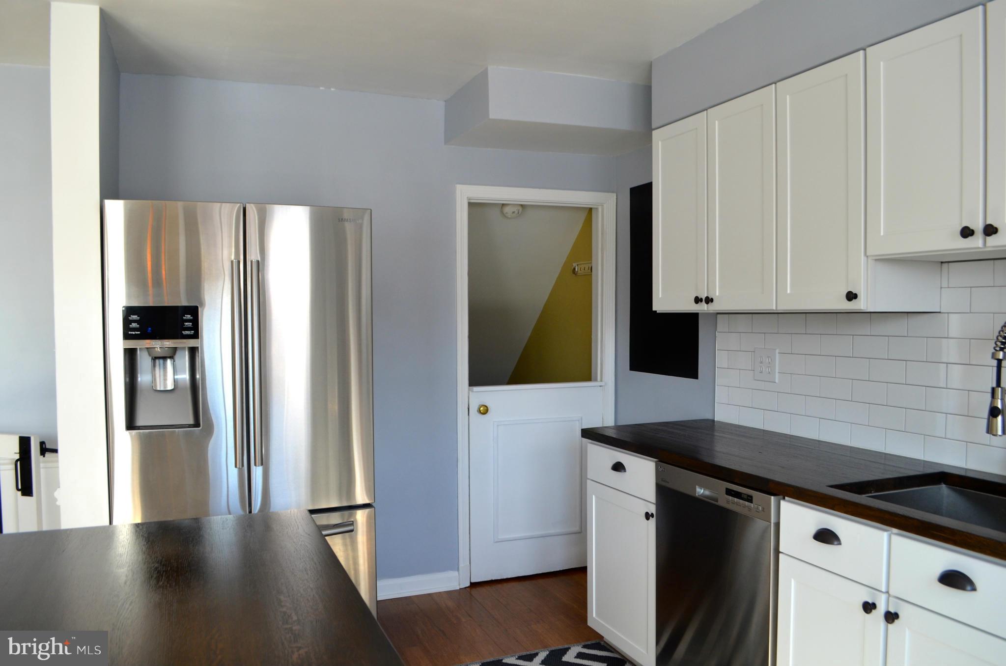 6109 Mt Ridge Road Baltimore, MD 21228 - Photo 8 of 26 White cabinets and new stainless appliances.