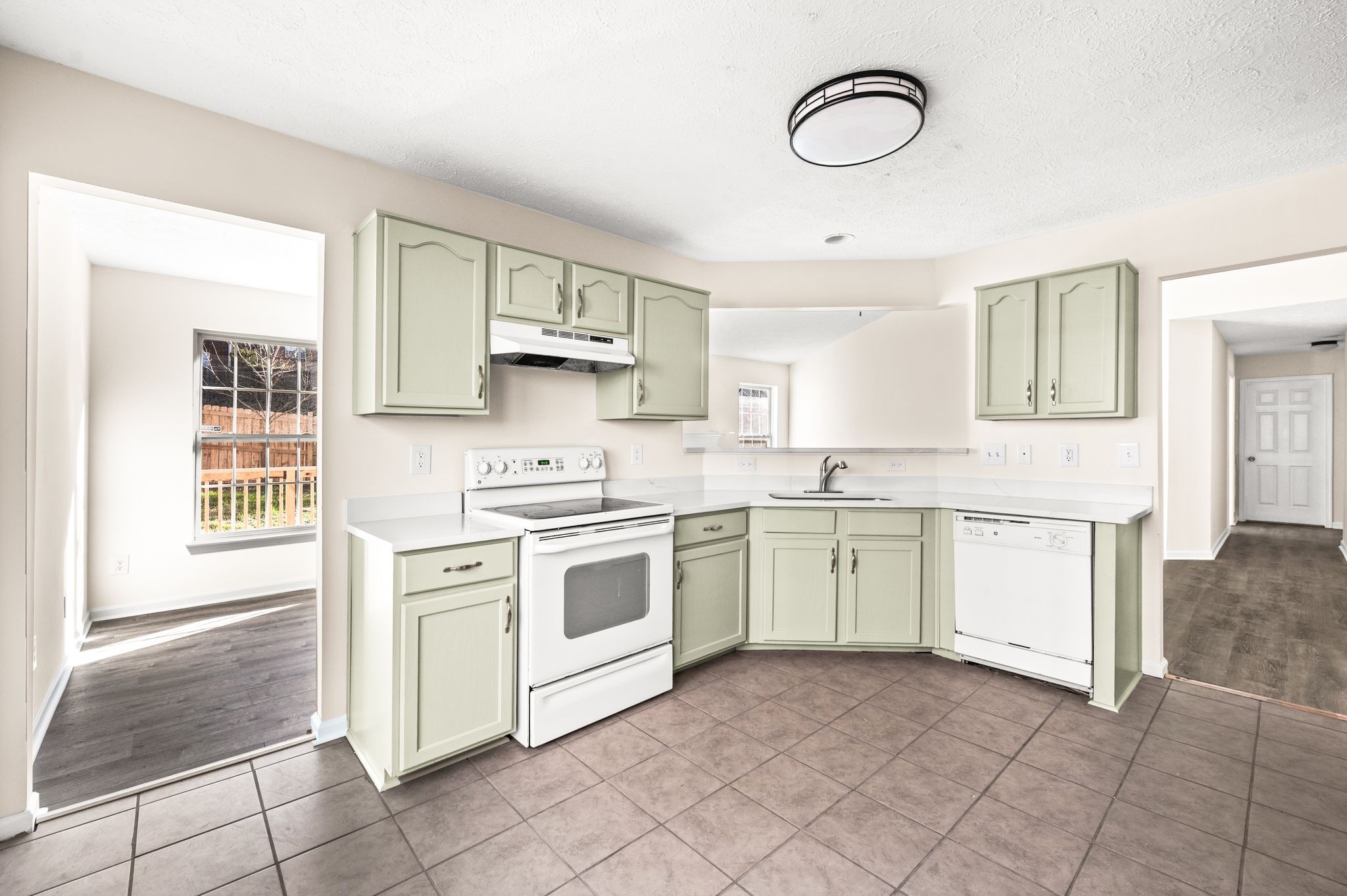 1304 West Running Brook Road Nashville, TN 37209 - Photo 11 of 28 a kitchen with cabinets appliances and a window