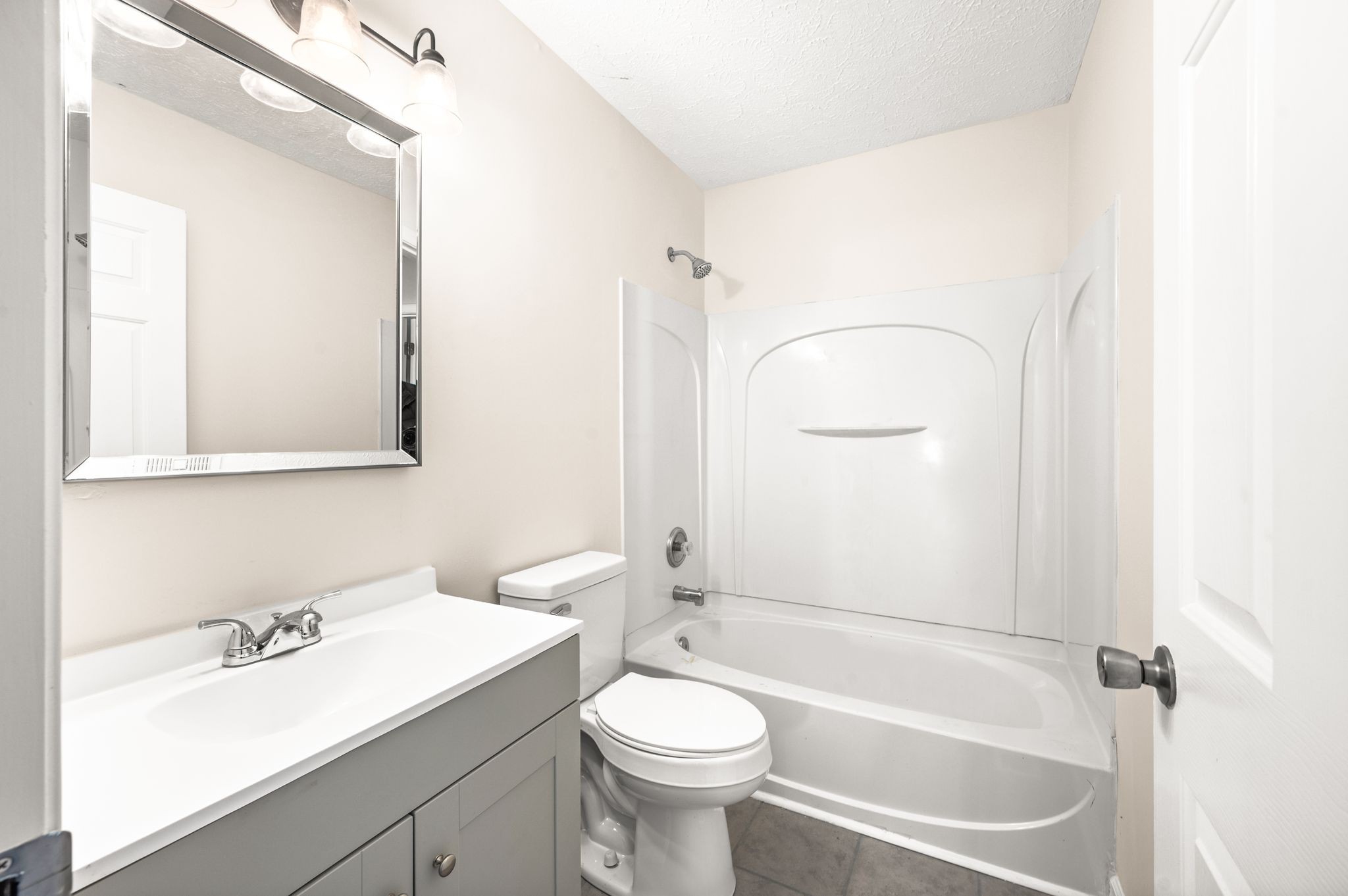 1304 West Running Brook Road Nashville, TN 37209 - Photo 23 of 28 a bathroom with a sink a toilet and a mirror