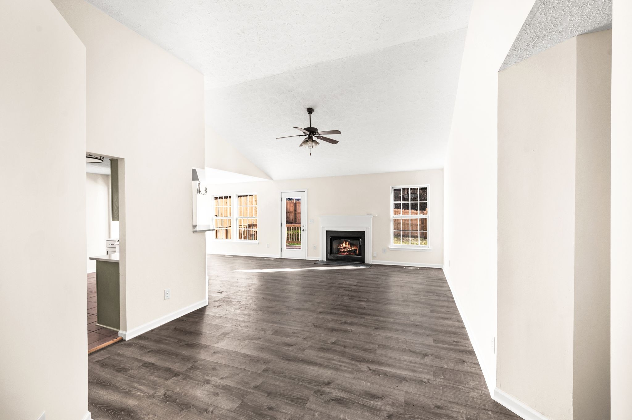 1304 West Running Brook Road Nashville, TN 37209 - Photo 4 of 28 a view of a livingroom with wooden floor a fireplace and windows
