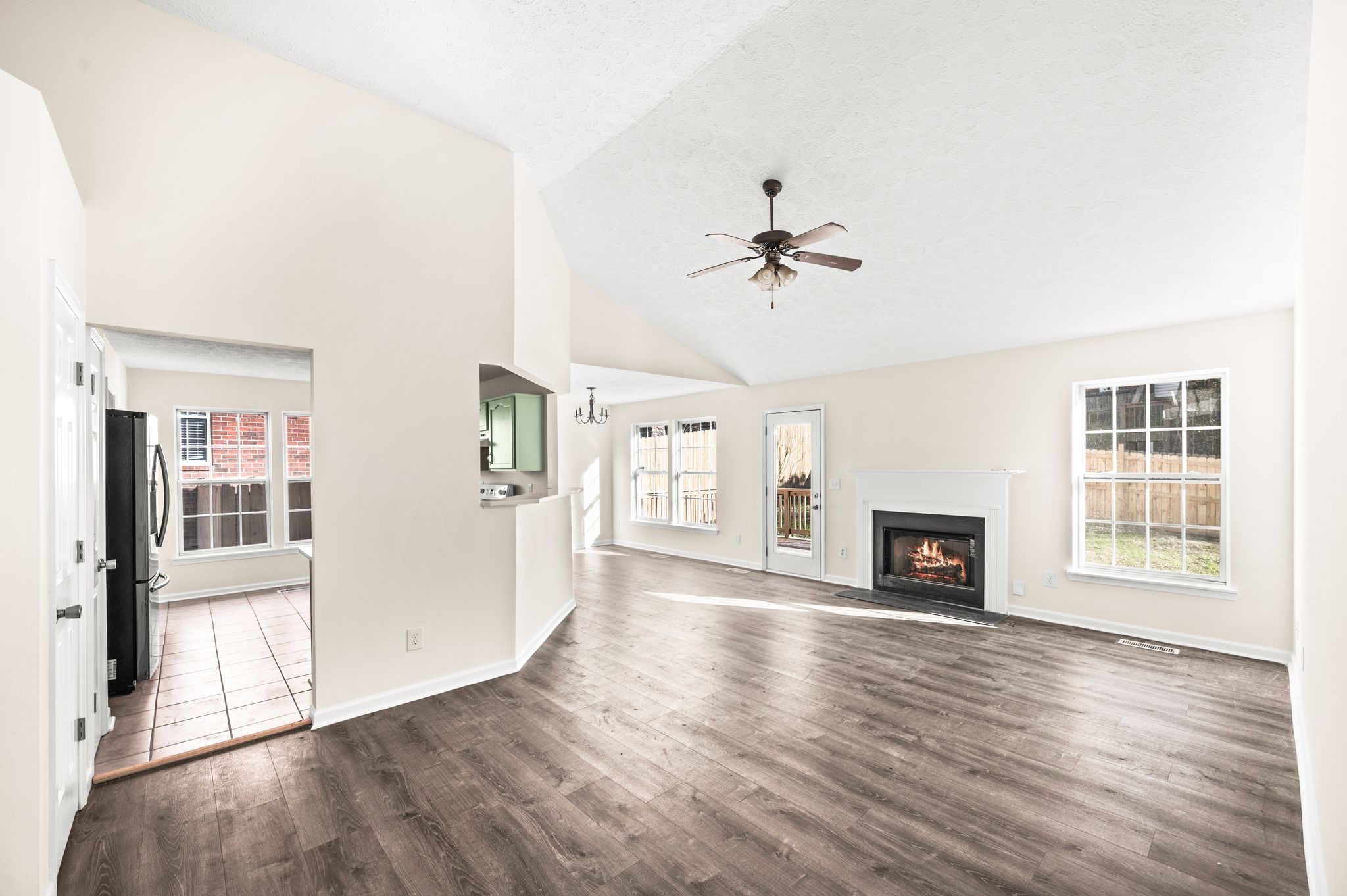 1304 West Running Brook Road Nashville, TN 37209 - Photo 6 of 28 a view of an empty room with window and wooden floor