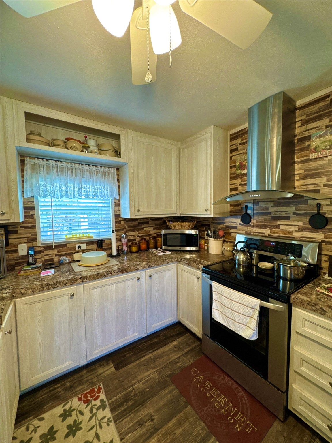 193 County Road 355 Jasper, TX 75951 - Photo 13 of 37 a kitchen with stainless steel appliances granite countertop a stove a sink and a microwave