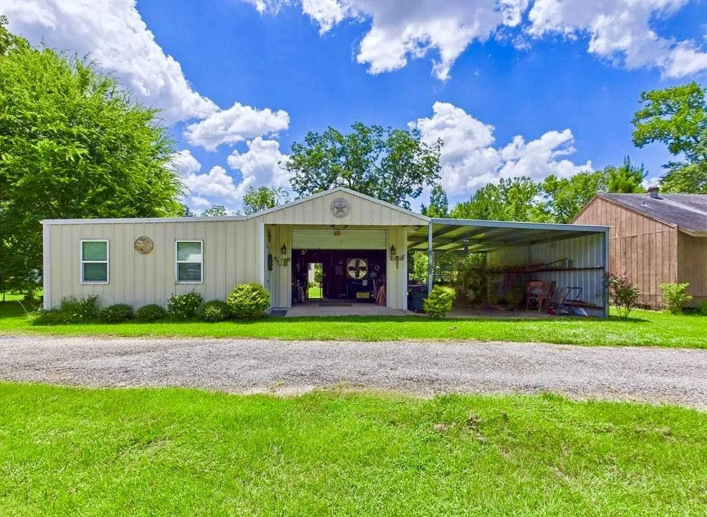 193 County Road 355 Jasper, TX 75951 - Photo 3 of 37 a view of a house with a yard and a large tree