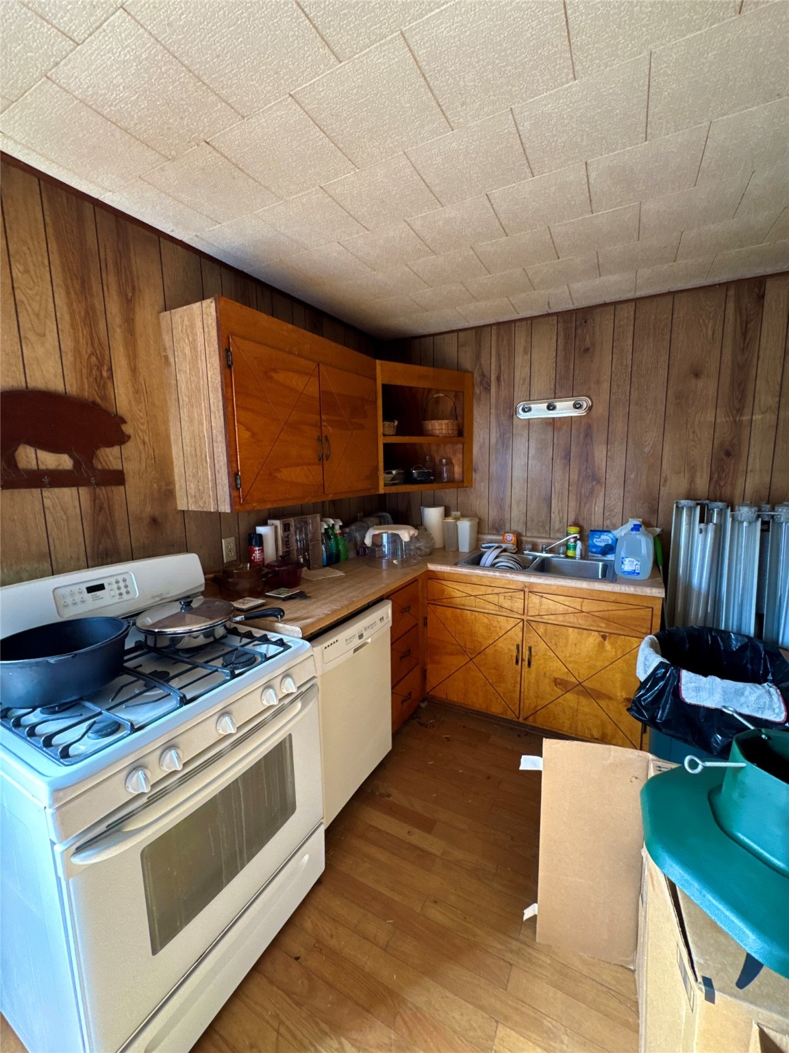 193 County Road 355 Jasper, TX 75951 - Photo 31 of 37 a kitchen with stainless steel appliances granite countertop a stove a sink dishwasher and a microwave oven with cabinets