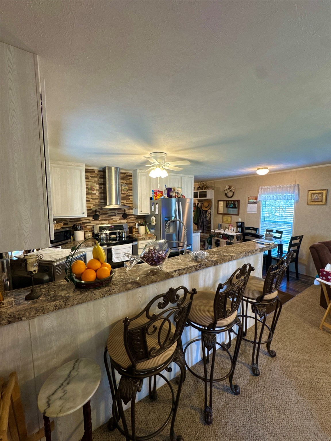 193 County Road 355 Jasper, TX 75951 - Photo 9 of 37 a view of a dining room with furniture and a kitchen