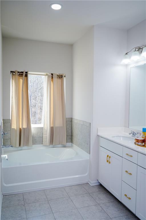 2115 Ravencliff Drive Austell, GA 30168 - Photo 12 of 21 a spacious bathroom with bathtub and shower