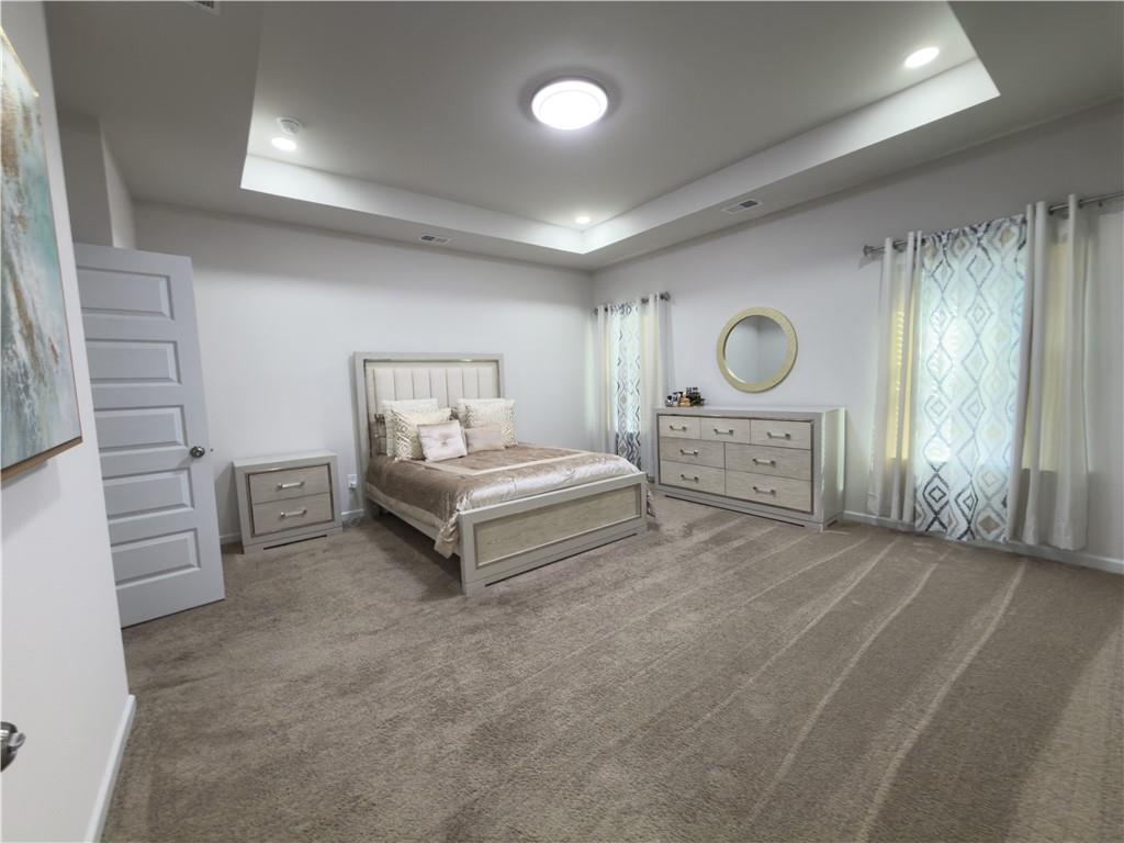 2115 Ravencliff Drive Austell, GA 30168 - Photo 14 of 21 a spacious bedroom with a bed and cabinets