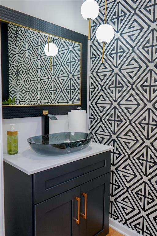 2115 Ravencliff Drive Austell, GA 30168 - Photo 16 of 21 a kitchen with a sink a mirror and cabinets