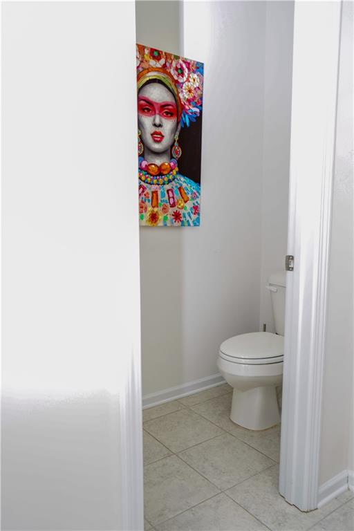 2115 Ravencliff Drive Austell, GA 30168 - Photo 18 of 21 a bathroom with a toilet and a shower curtain