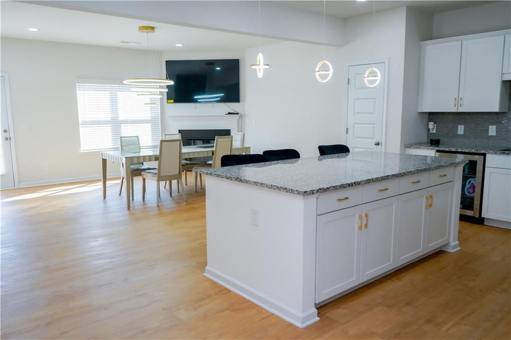 2115 Ravencliff Drive Austell, GA 30168 - Photo 6 of 21 a kitchen with a sink white cabinets and chairs