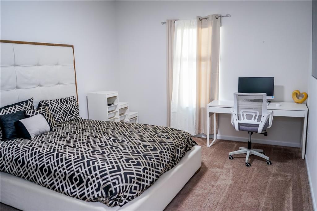 2115 Ravencliff Drive Austell, GA 30168 - Photo 8 of 21 a bedroom with a bed and a window