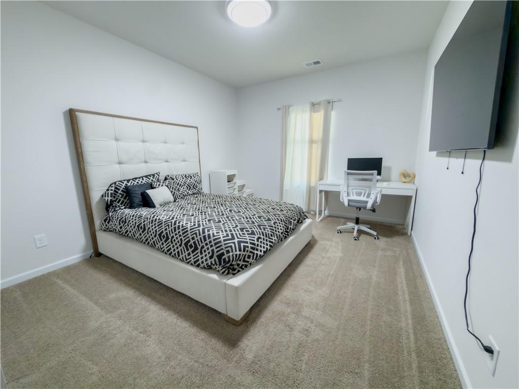 2115 Ravencliff Drive Austell, GA 30168 - Photo 9 of 21 a bed room with a bed window and a television