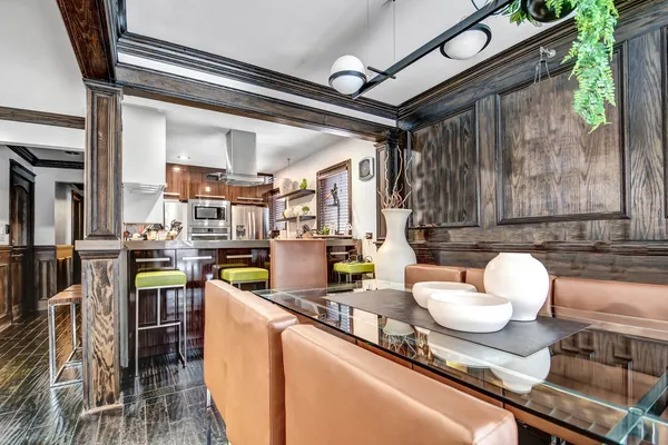 a kitchen with a table and chairs in it