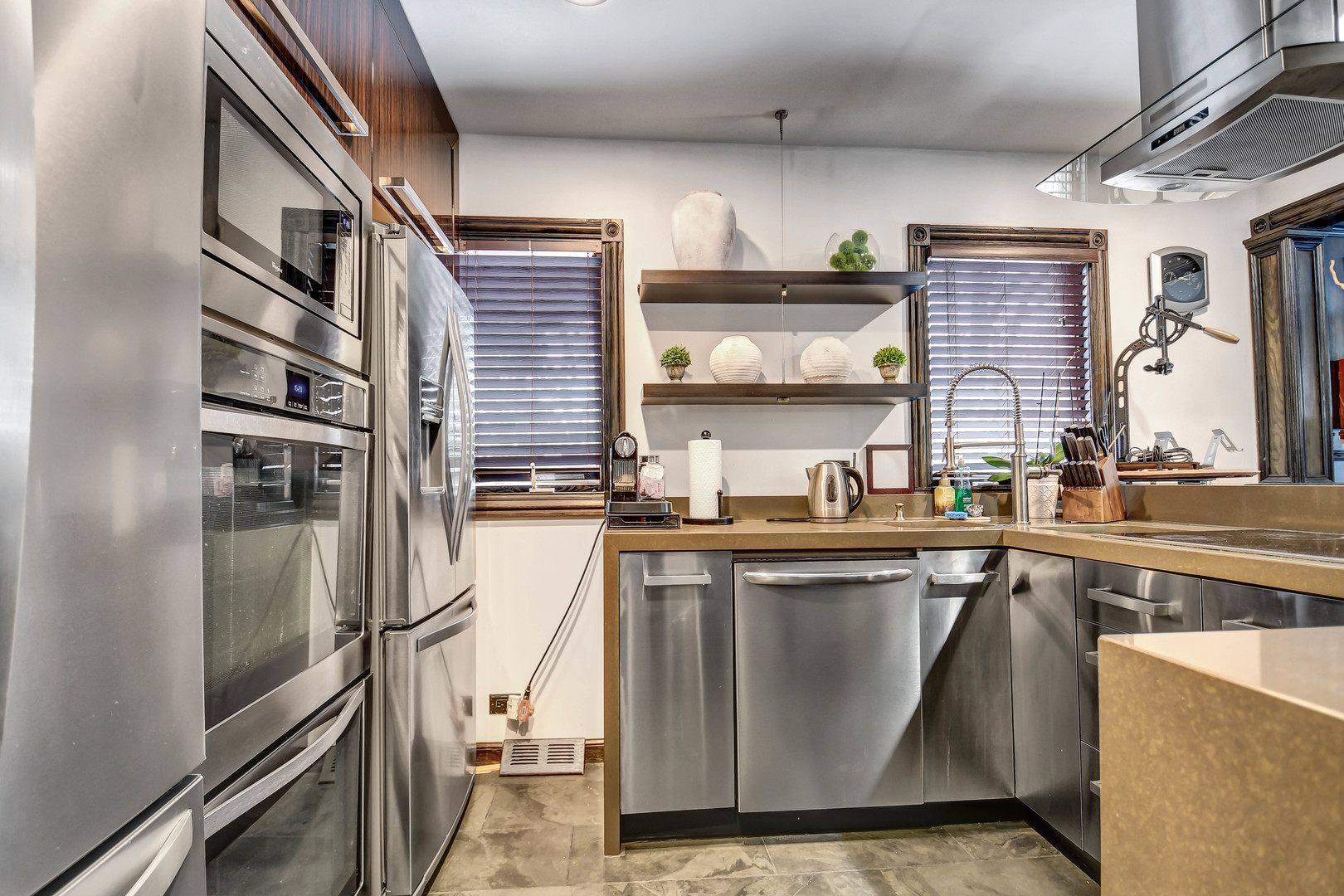 491 Old Surrey Road, Unit A Hinsdale, IL 60521 - Photo 9 of 23 a kitchen with stainless steel appliances granite countertop a sink a stove and a refrigerator