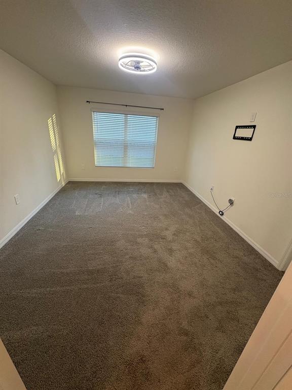 6910 Southeast 112th Street Belleview, FL 34420 - Photo 16 of 20 an empty room with a empty space and windows