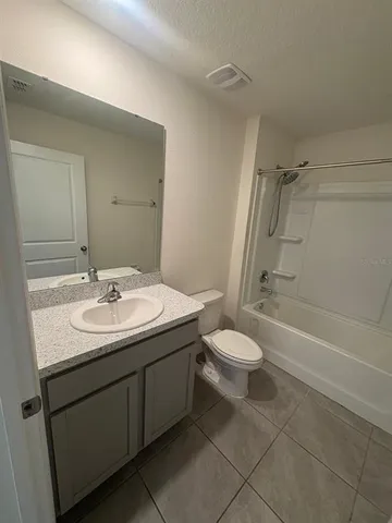 a bathroom with a toilet a sink and a bathtub