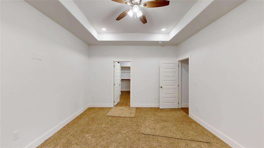 1615 Poplar Street Dallas, TX 75215 - Photo 14 of 31 an empty room with closet and ceiling fan