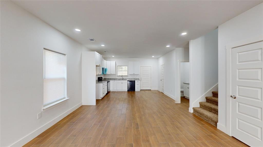 1615 Poplar Street Dallas, TX 75215 - Photo 8 of 31 a view of a kitchen with wooden floor and a sink