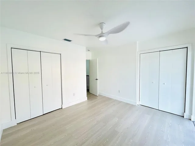 a bathroom with a granite countertop sink a shower and a mirror
