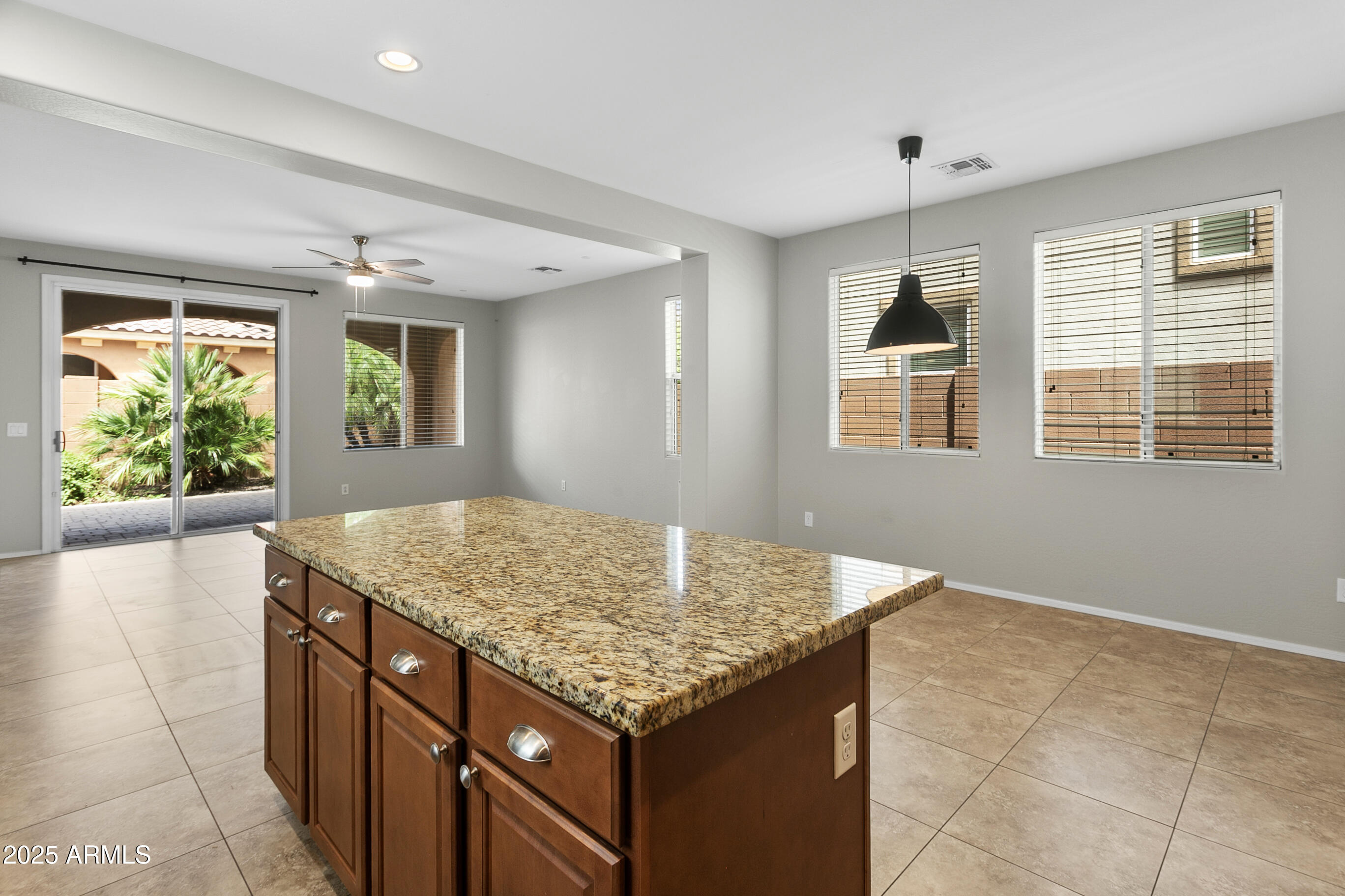 9124 South Roberts Road Tempe, AZ 85284 - Photo 11 of 27 a kitchen with granite countertop sink and cabinets