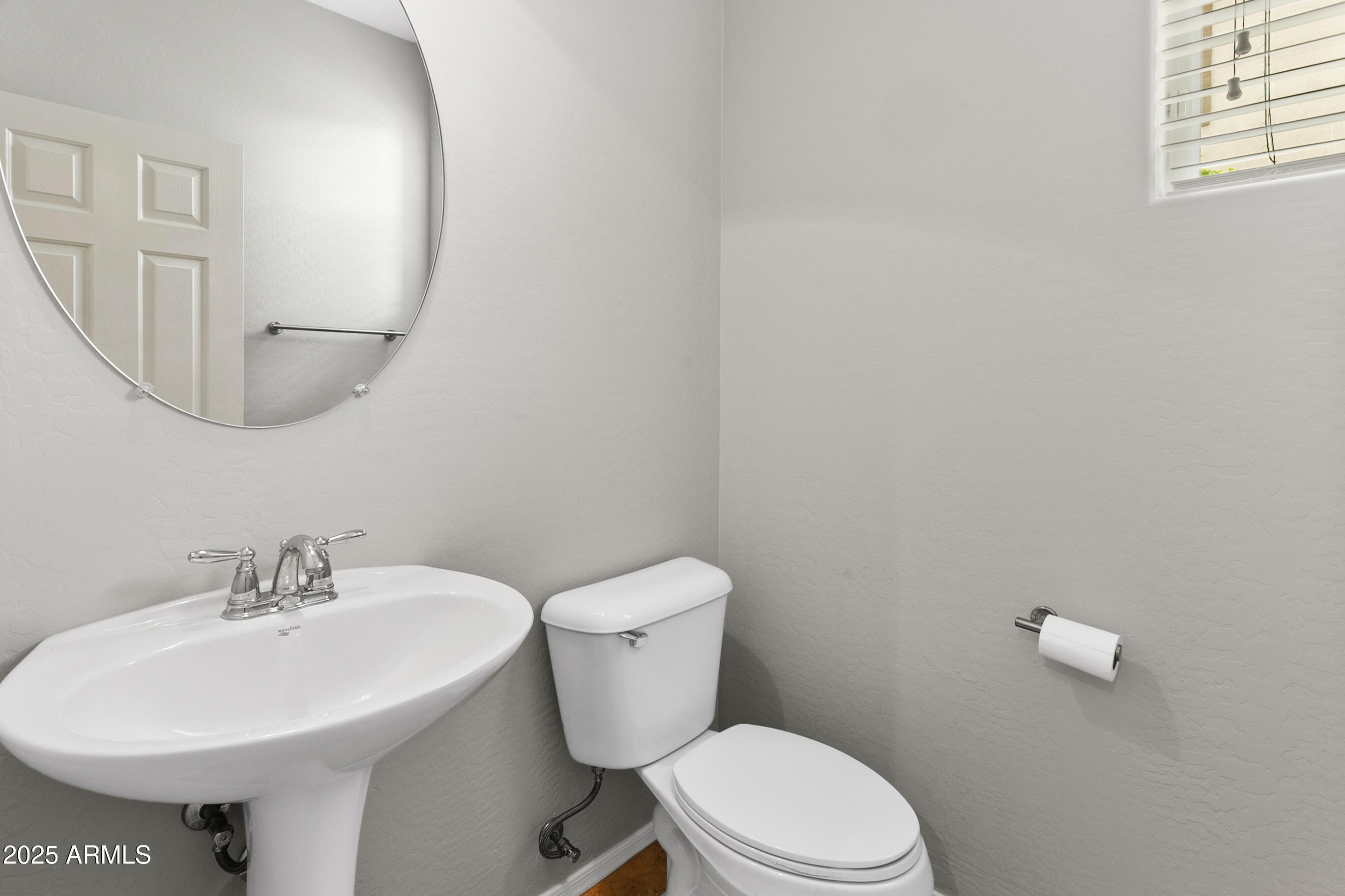 9124 South Roberts Road Tempe, AZ 85284 - Photo 15 of 27 a white toilet sitting next to a white sink