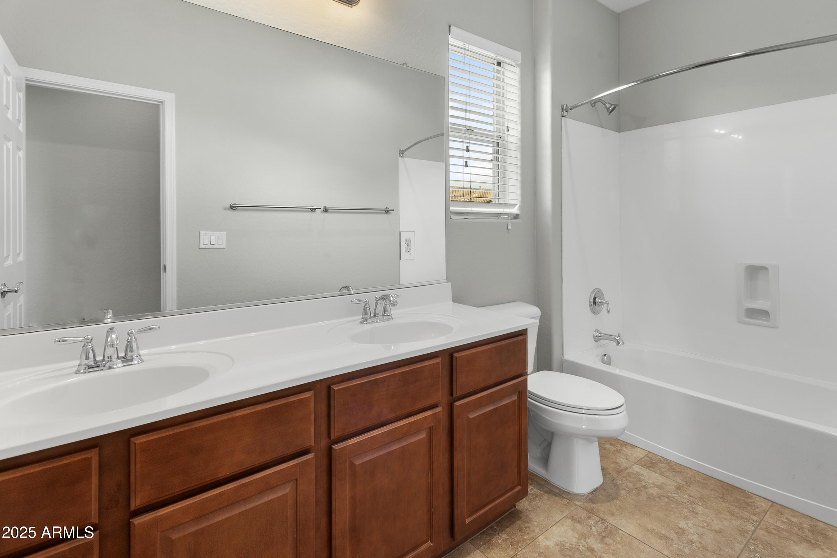 9124 South Roberts Road Tempe, AZ 85284 - Photo 18 of 27 a bathroom with a sink toilet a mirror and shower