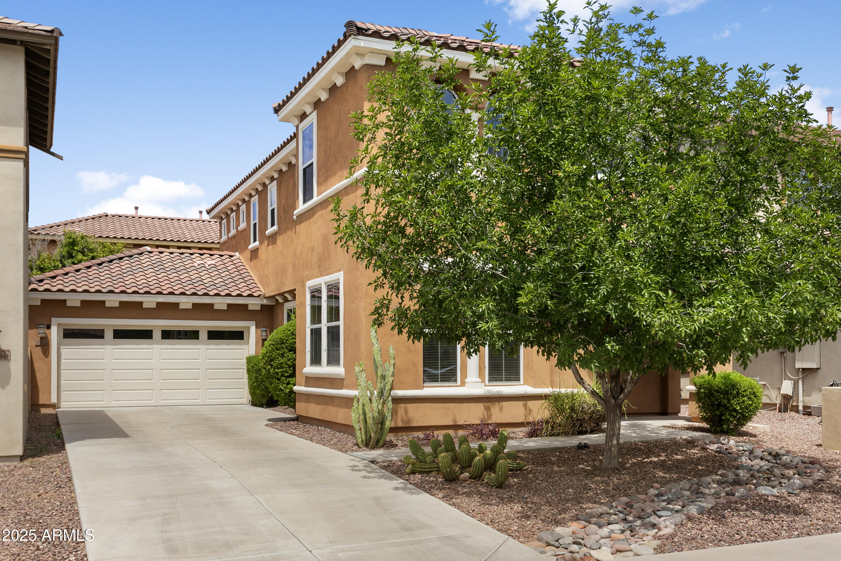 9124 South Roberts Road Tempe, AZ 85284 - Photo 2 of 27 a front view of a house with a garage
